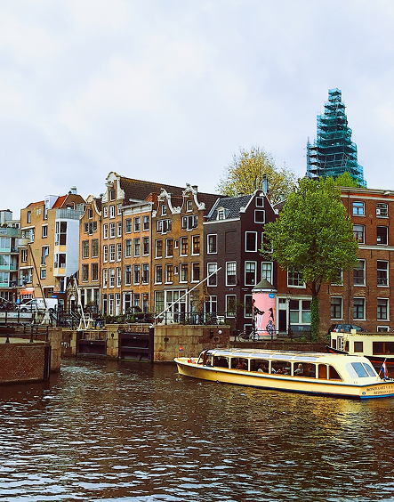 Amsterdam canal with traditional Dutch houses and boat
